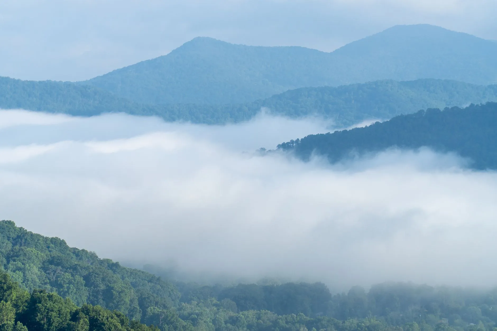 Blue ridges above valley fog